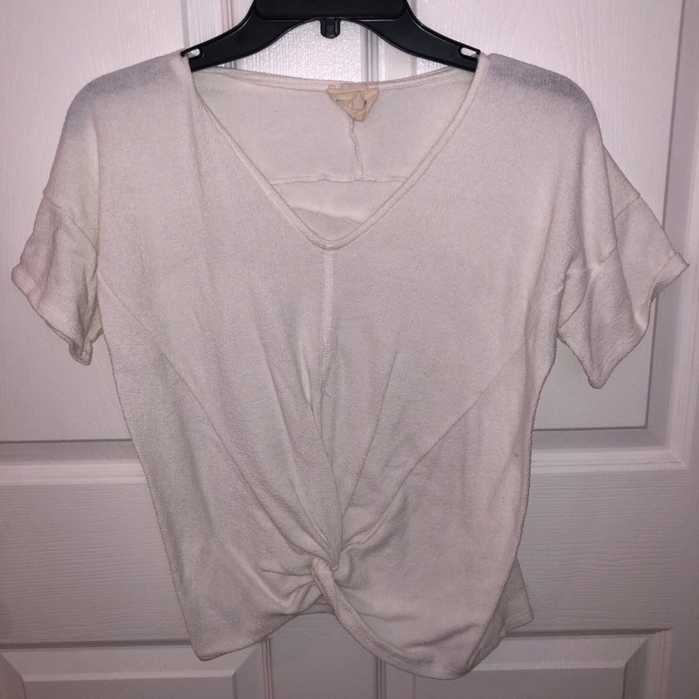 White top with tie at bottom